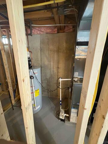 Naugatuck, CT - Discreet Radon Mitigation in a Framing-in-Progress Basement