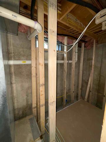 Naugatuck, CT - Discreet Radon Mitigation in a Framing-in-Progress Basement