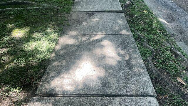 Before: Sidewalk Out of Alignment
