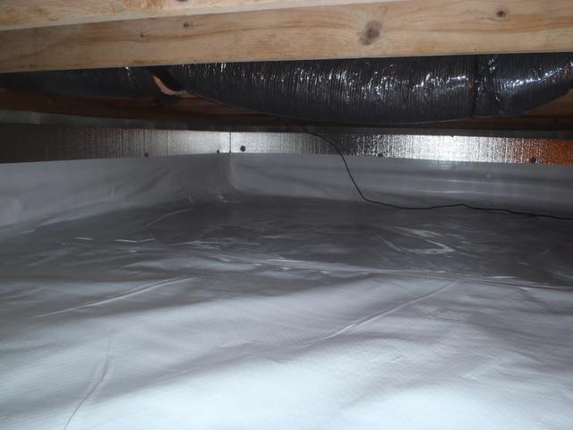 SilverGlo and Cleanspace liner have been applied along the walls and floor of the crawl space to keep it properly insulated and clean. 