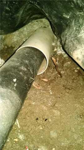 Improperly installed drainage line. 