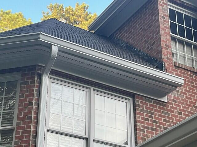 Side of home after gutter installation