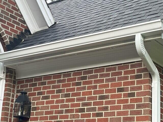 Side of home after gutter installation