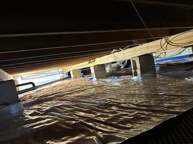 Laying Down Vapor Barrier