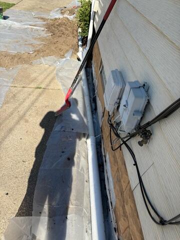 Installing Exterior Drainage Line and Downspout Extension