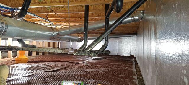 The crawl space with drainage matting and SilverGlo©