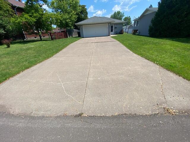 Wide view of cracked driveway
