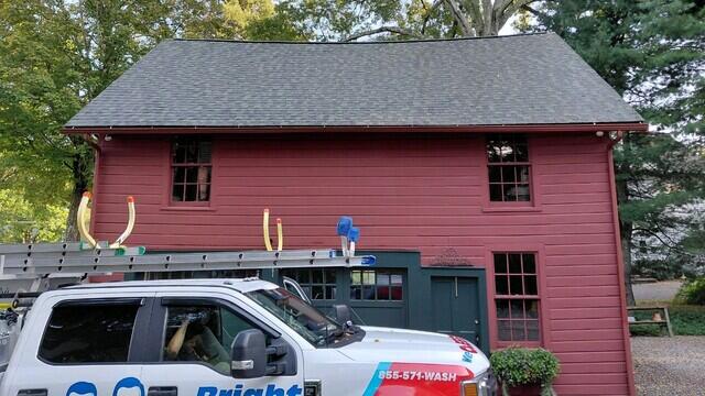 Algae stains treated on barn roof