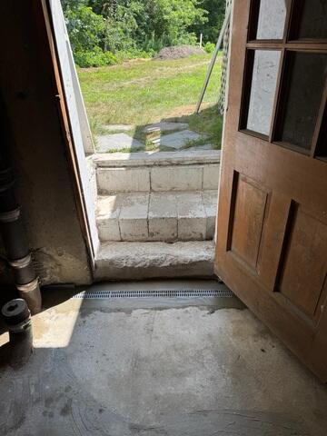 Radon Sealed Surface Drainage in Front of Doorway Entrance