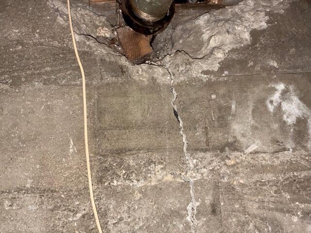 Cracked Foundation Around Pipe Prior to Retrofitting