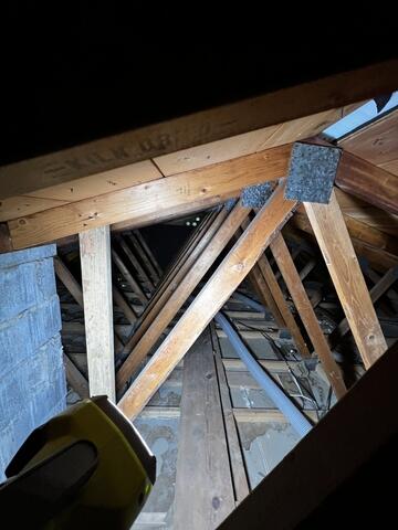 Installers Working to Repair Attic