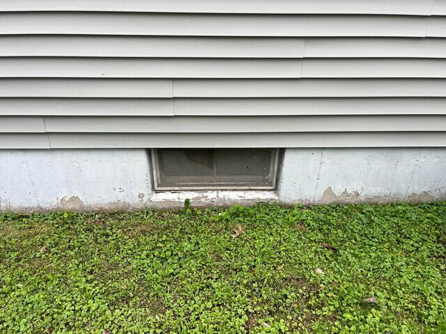 Before Davenport Basement Window Replacement