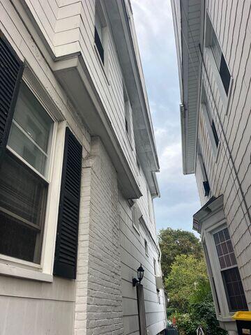 Chimney damage and worn shingles