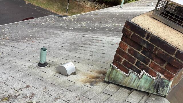 Before: Deteriorating Shingles & Flashing