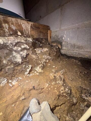 Rocky, Dirt Crawl Space with Water Seepage