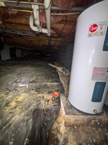 Dark, Musty Crawl Space with Water Heater