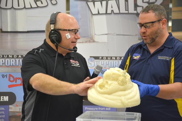 Jim touches the foam to see how it has set up. 