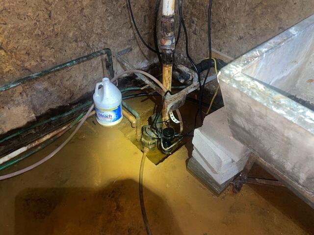 Before: Standing Water and Old Pump