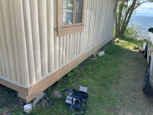 Before: Settling Cabin Near Lake Shore