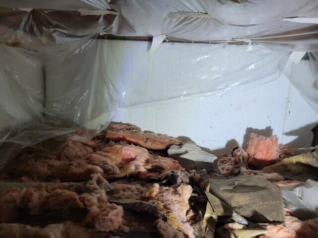 Insualting floor joists.