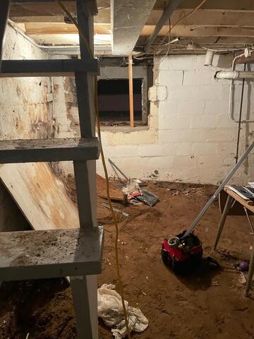 Before: Dirt-Floor Basement With Water Damage