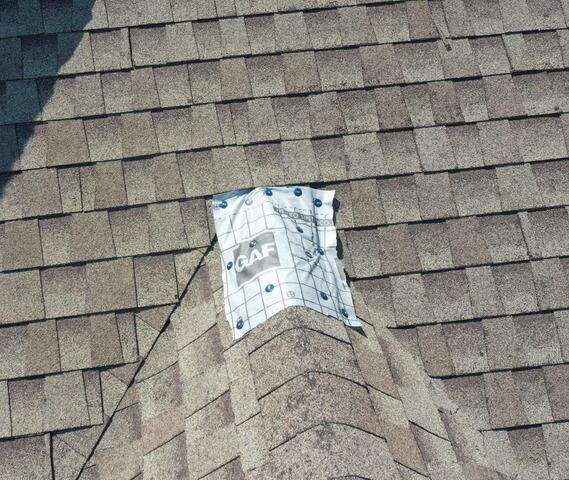 Emergency tarp installation after hail damage