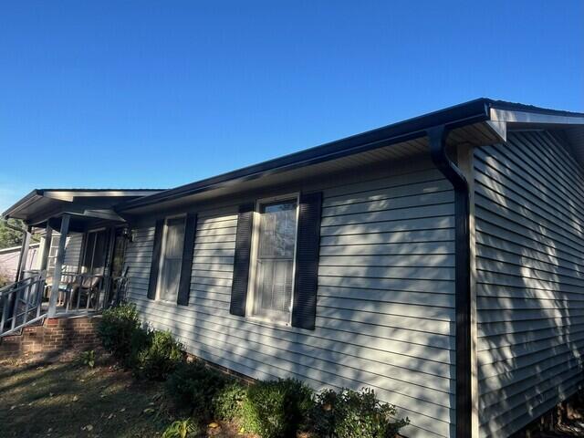 Side of home after gutter installation