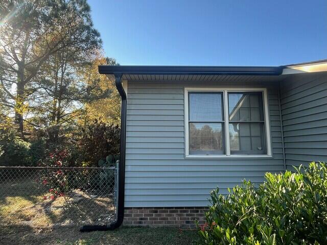 Side of home after gutter installation