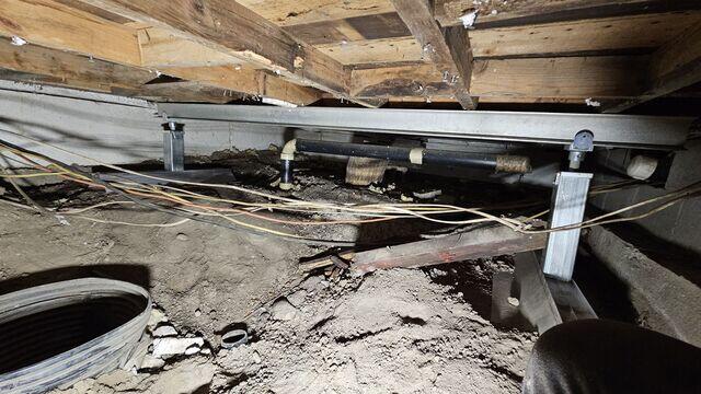 SmartJack® Columns Secured Along Main Beam for Structural Correction