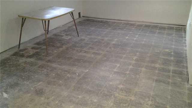 Water Damaged Basement Floor in E. Elmhurst