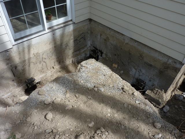 This photo shows three of the fourteen piers that were installed. This is the SW corner of the home foundation.