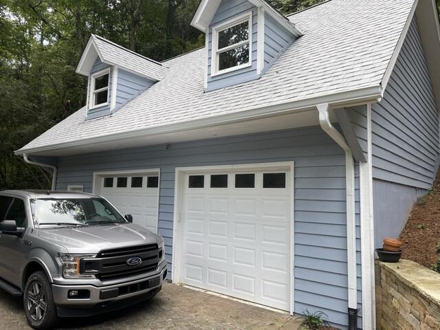 New gutters and downspouts