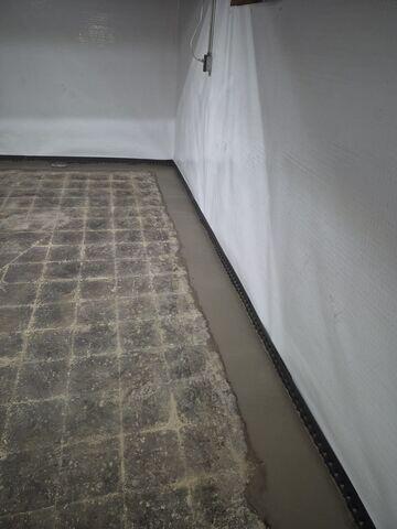 Basement Drainage System with Wall Encapsulation