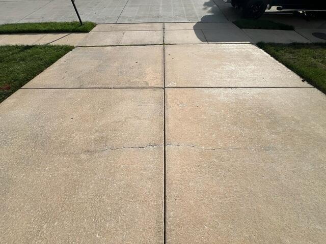 Cracked Concrete and Uneven Driveway