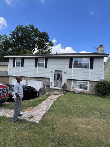 Inspecting the gutters with the homeowner