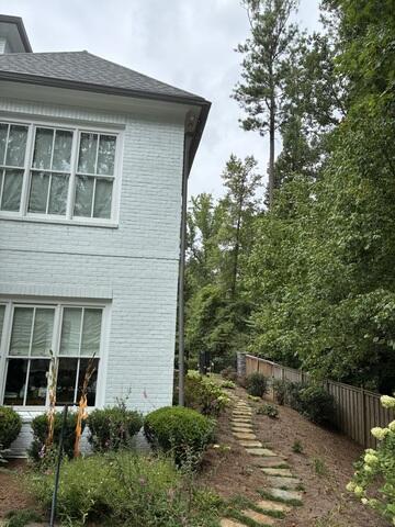 Downspout disconnected from side of home