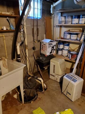 Before: Basement Waterproofing (Old Sump Pump)