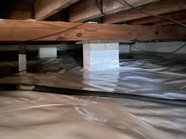 Sealing Crawl Space with Moisture Barrier