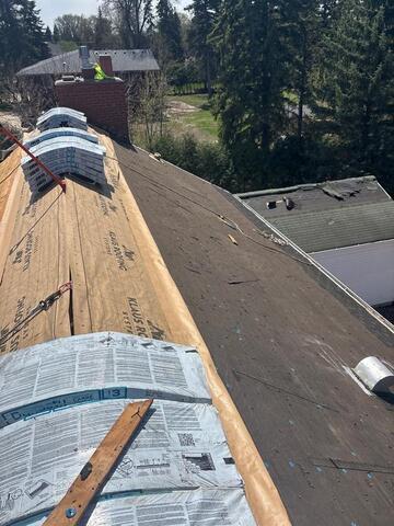 Shingles removed and decking replaced