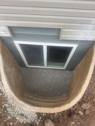 Egress Window Well Installed with Proper Drainage