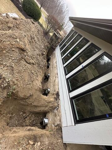 Installing Helical Piers for Foundation Stabilization