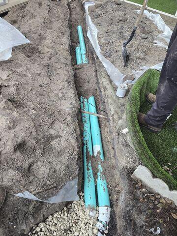 Excavating Trench and Installing Drainage Pipe