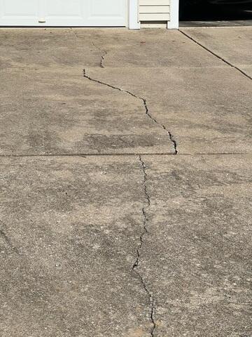 Concrete Driveway Cracking Before Repair