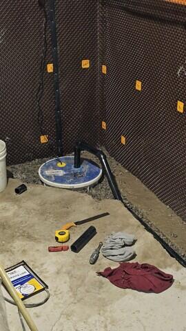 The pump and lid is installed and the discharge line is added.