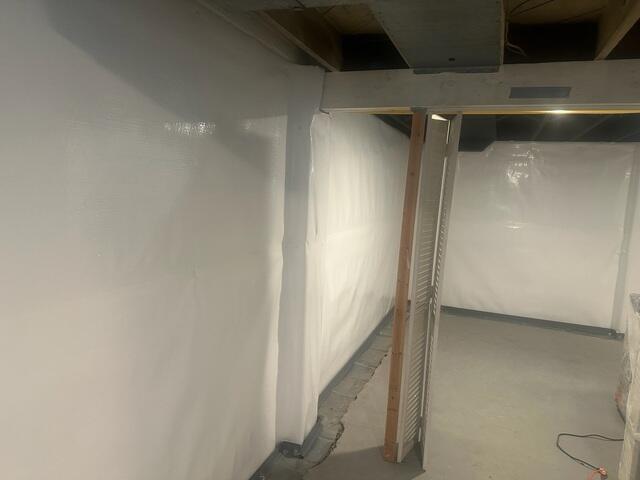 Installing Interior Drainage System and CleanSpace® Wall Vapor Barrier System in Grosse Pointe, MI Basement