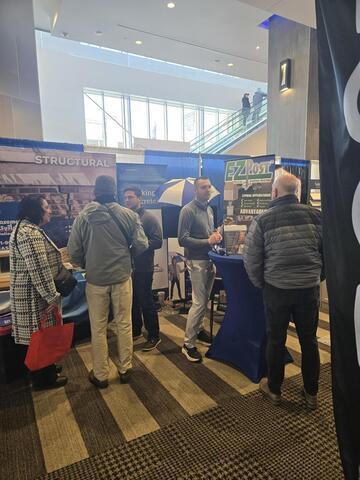 Sam and Ryan Talking To Home Show Visitors