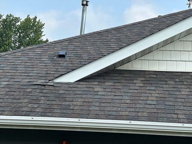 Another damaged shingle inspected the entire roof and needed to see under the shingles to correctly evaluate the situation.
