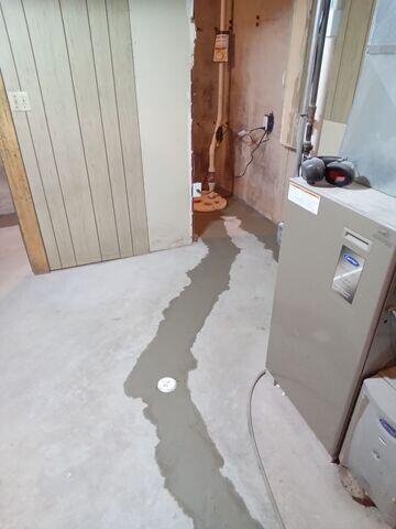 WaterGuard Interior Drainage System Connecting to SuperSump Sump Pump System