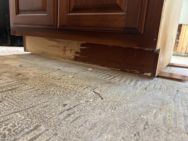 Water Damaged Cabinet and Flooring Repair