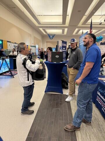 David and Brett Learning About A Customer's Wet Basement